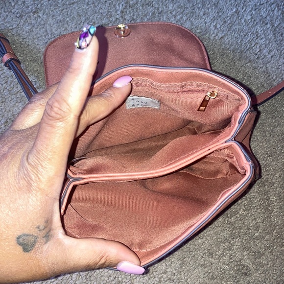 This is a peach color, a crossbody bag from target. - Picture 2 of 4